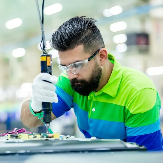 manufacturing_man_circuit_board_soldering_gun--ratio01x01--width960px