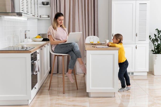 woman-working-remotely-with-kid-full-shot
